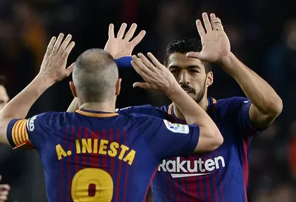 Andrés Iniesta y Luis Suárez